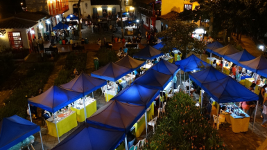 An overview of a Paisa Town with tents and shops in Medellin